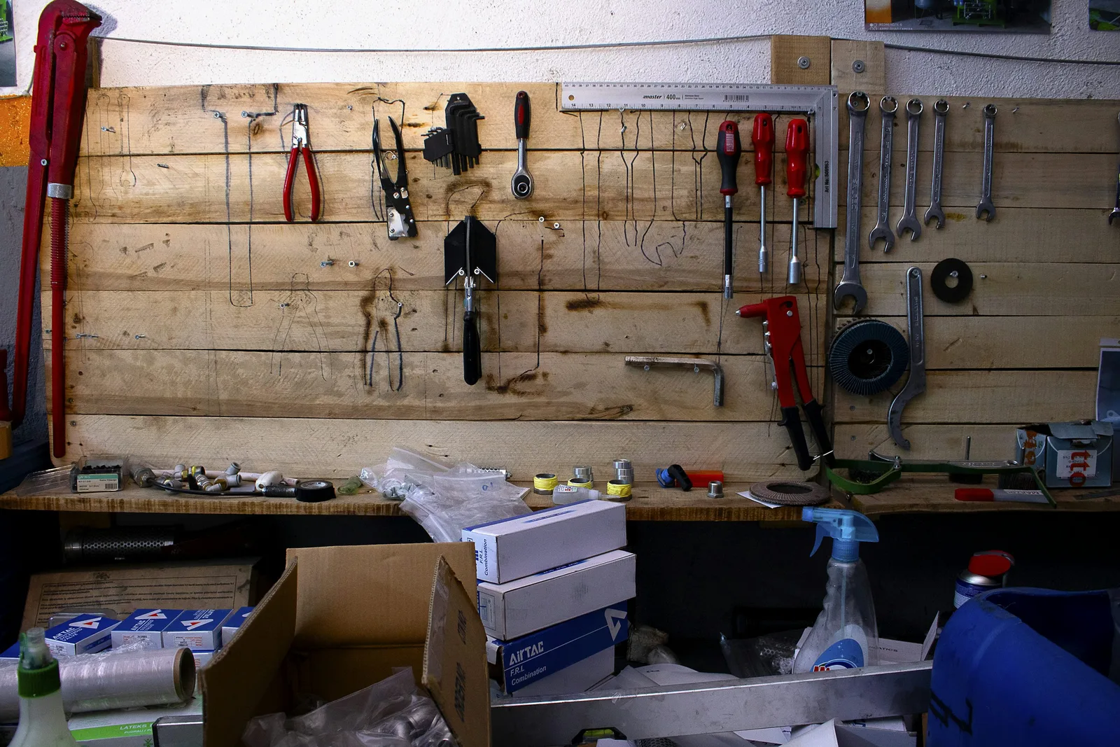 A real repair workbench with organized hand tools and equipment